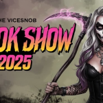 A promotional banner for "The Vicesnob Spook Show 2025". A woman in skull makeup and gothic attire holds a glowing pink scythe in a spooky forest, representing a list of the best movies to watch on Halloween.