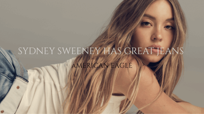 Sydney Sweeney reclining with her long hair flowing, wearing a white top and blue jeans