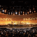 Emmy Awards 2025 stage lit with golden lights and city skyline backdrop, highlighting the start of the nomination event.