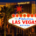 The famous “Welcome to Fabulous Las Vegas” sign glowing at night, symbolizing Las Vegas tourism and nightlife culture.