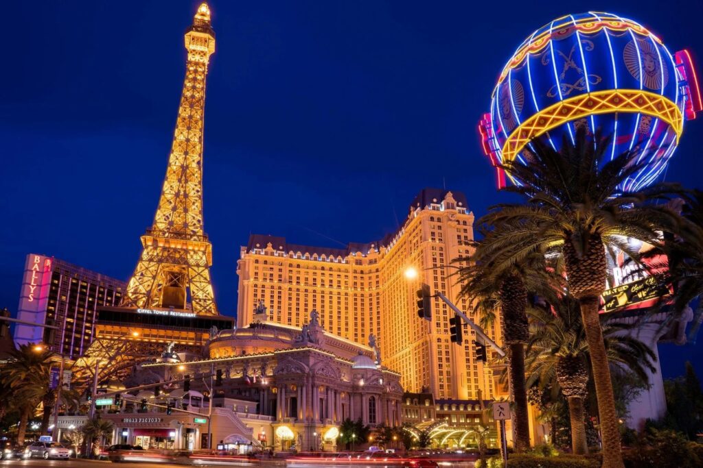 Iconic Las Vegas Strip view featuring the Paris Hotel and Eiffel Tower replica, a popular attraction in Las Vegas tourism.