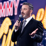 Jimmy Kimmel speaking on stage during his late-night show, amid controversy over declining viewership. Jimmy Kimmel ratings have dropped significantly after political remarks.