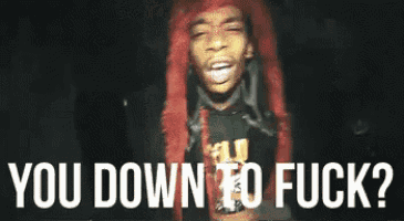 A GIF of a person with bright red hair and a chain around their neck, mouthing a phrase. The text "YOU DOWN TO FUCK?" is overlaid on the image, explaining the meaning of the acronym DTF.