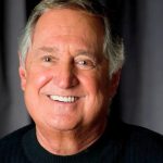 A somber article graphic reporting on the passing of Neil Sedaka at 86 and the outpouring of grief from his fans.