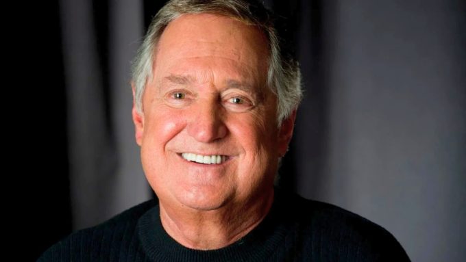 A somber article graphic reporting on the passing of Neil Sedaka at 86 and the outpouring of grief from his fans.