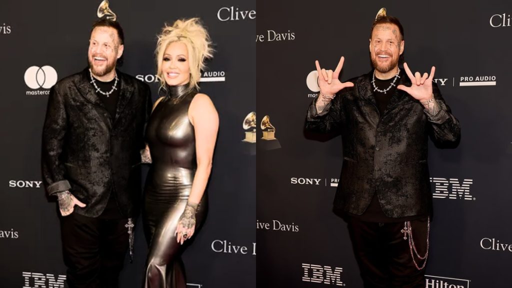 A striking full-length image of the singer on the red carpet at a pre-Grammy event, showcasing his dramatic Jelly Roll Weight Loss. He is wearing a textured black suit and smiling confidently, appearing significantly leaner than in previous years as he poses for photographers.