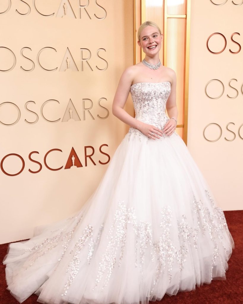 Elle Fanning wearing an ethereal white lace Givenchy gown