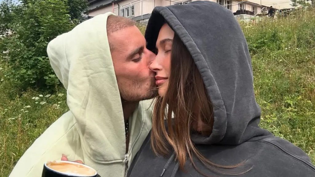 Justin and Hailey Bieber sharing an intimate moment outdoors, highlighting the private nature of the Justin Bieber Birthday celebrations.