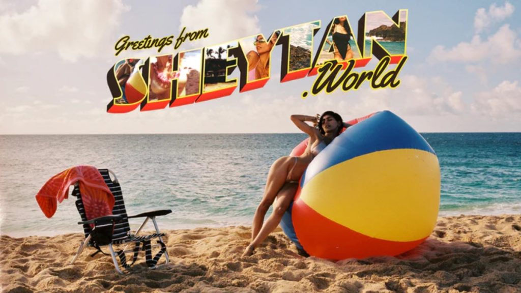 A bright, beach-themed graphic titled "Greetings from Sheytan World," featuring Mia Khalifa lounging against a massive beach ball on a sunny shore. This promotional art showcases the entrepreneurial ventures that fuel the Mia Khalifa Net Worth.