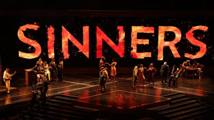 Promotional graphic for the movie Sinners celebrating its success at the 98th Academy Awards. The text highlights "Sinners Shines at Oscars 2026" and "All 4 Historic Wins Revealed," featuring the keyword sinners oscar wins 2026.