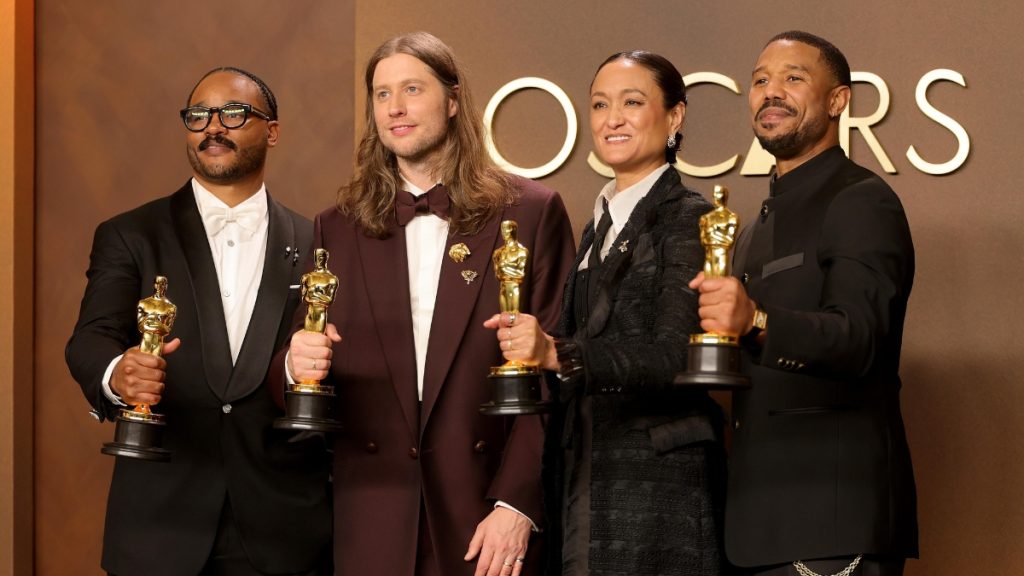 A celebratory image announcing that the film sinners oscar wins 2026 totaled four Academy Awards, including Best Actor for Michael B. Jordan and Best Original Screenplay for Ryan Coogler.