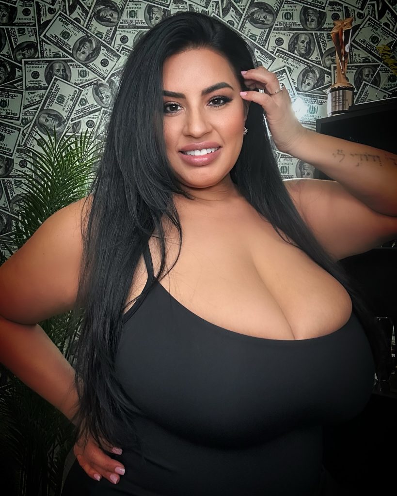 A studio headshot of Sofia Rose, showcasing her as a prominent curvy influencer with an elegant look.