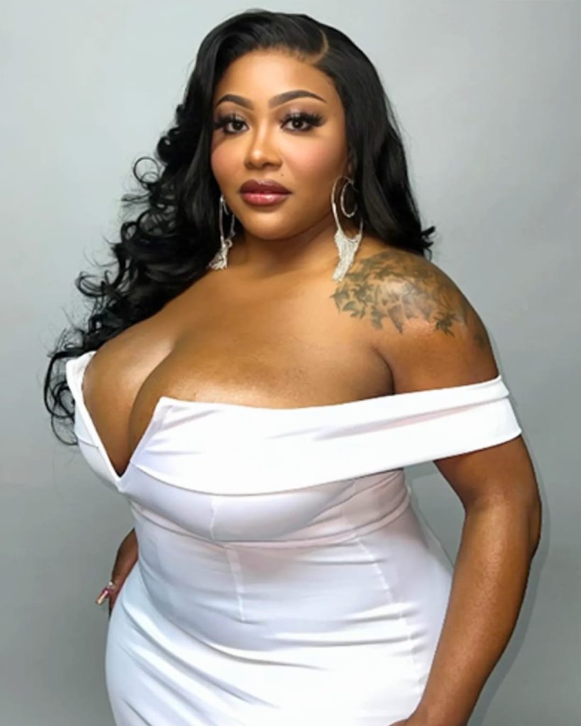 Ts Madison transgender influencer and OnlyFans personality wearing a white off-shoulder dress, portrait of popular trans social media star and entertainer.