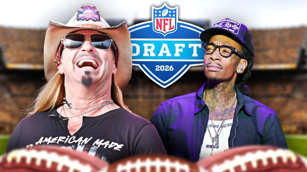 A celebratory graphic featuring Bret Michaels NFL Draft performer and Wiz Khalifa in front of a 2026 NFL Draft logo. On the left, Bret Michaels is seen laughing in a cowboy hat and sunglasses, wearing an "American Made" t-shirt. On the right, Wiz Khalifa wears a black baseball cap and glasses. The background shows a blurred football stadium, with the tops of two footballs visible in the foreground.