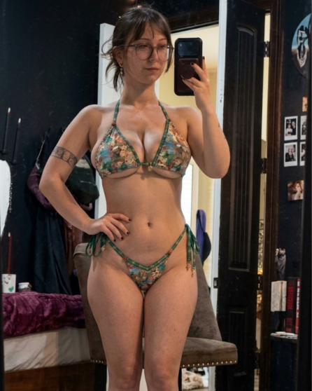 Mirror selfie Goth Egg (Lee) in a floral bikini.