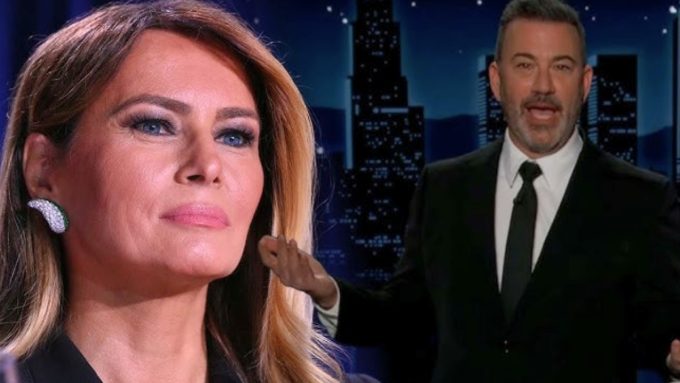 A side-by-side composite image featuring a close-up of Jimmy Kimmel and Melania Trump. On the left, Melania Trump is shown in a headshot with a neutral expression, wearing a large sparkling earring. On the right, Jimmy Kimmel is pictured in a black suit and tie against a late-night talk show backdrop featuring a stylized city skyline at night.