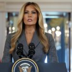 A news-style graphic featuring a photo of Melania Trump looking directly at the camera. Overlaid text reads, "Melania Trump Denies Close Ties in Rare Statement" regarding public speculation.