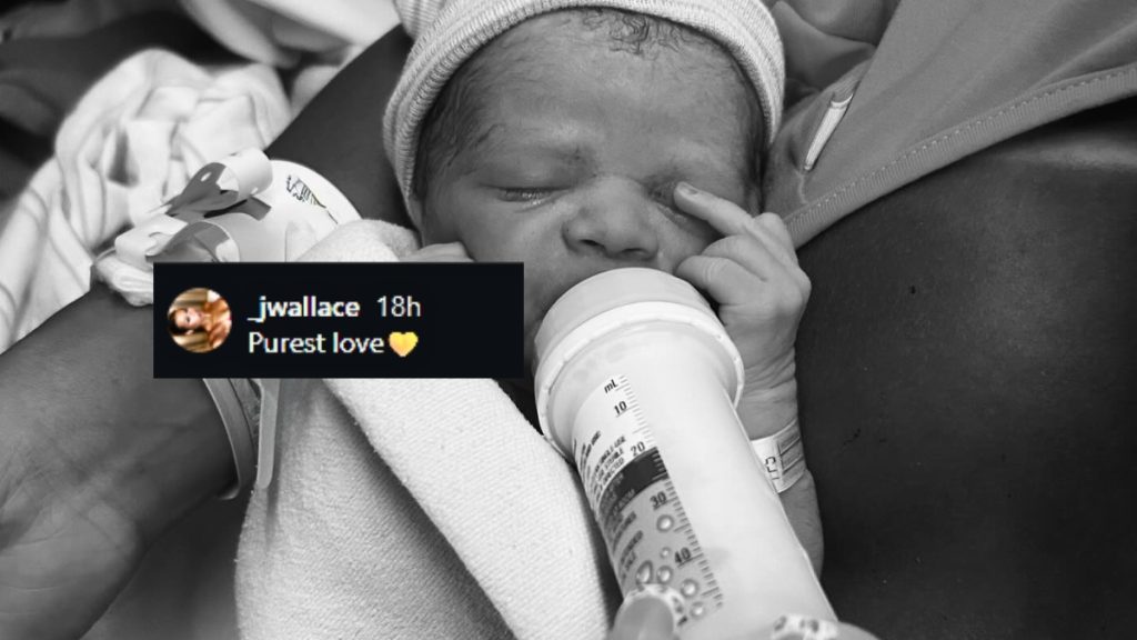 A black and white close-up of a newborn baby wearing a knit cap and being bottle-fed. An Instagram comment overlay from account "_jwallace" reads "Purest love 💛".
