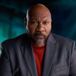 Cinematic portrait of Ving Rhames in a grey blazer, highlighting his iconic presence for a digital media project.