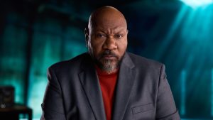 Cinematic portrait of Ving Rhames in a grey blazer, highlighting his iconic presence for a digital media project.