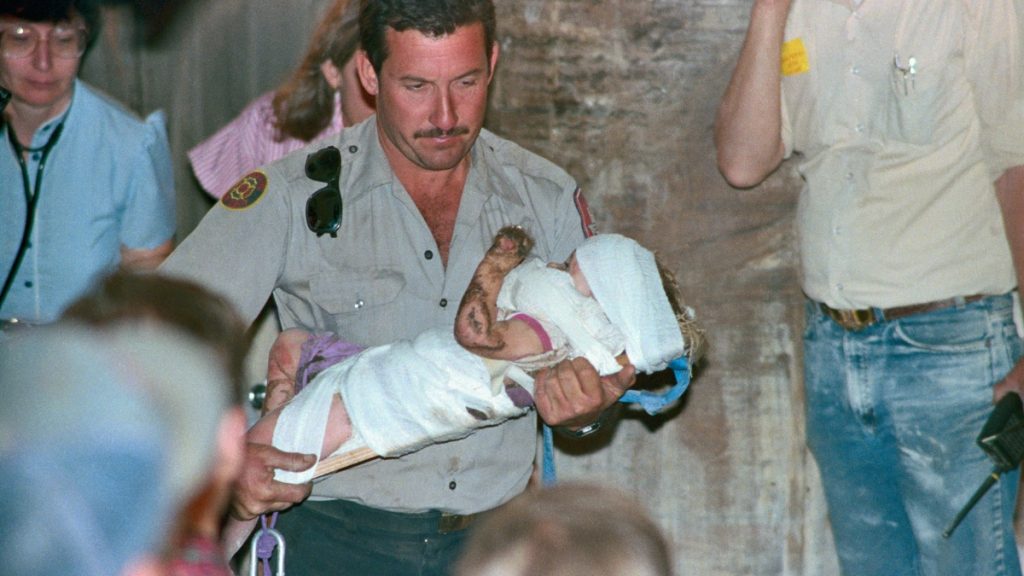 A vintage photograph of a young Jessica McClure as a toddler rescued from well