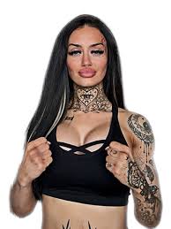 Portrait of Irish OnlyFans model Meghan O'Neill (Skye Fox) in a black criss-cross sports bra, showcasing her distinctive heart-shaped neck tattoo and long dark hair.