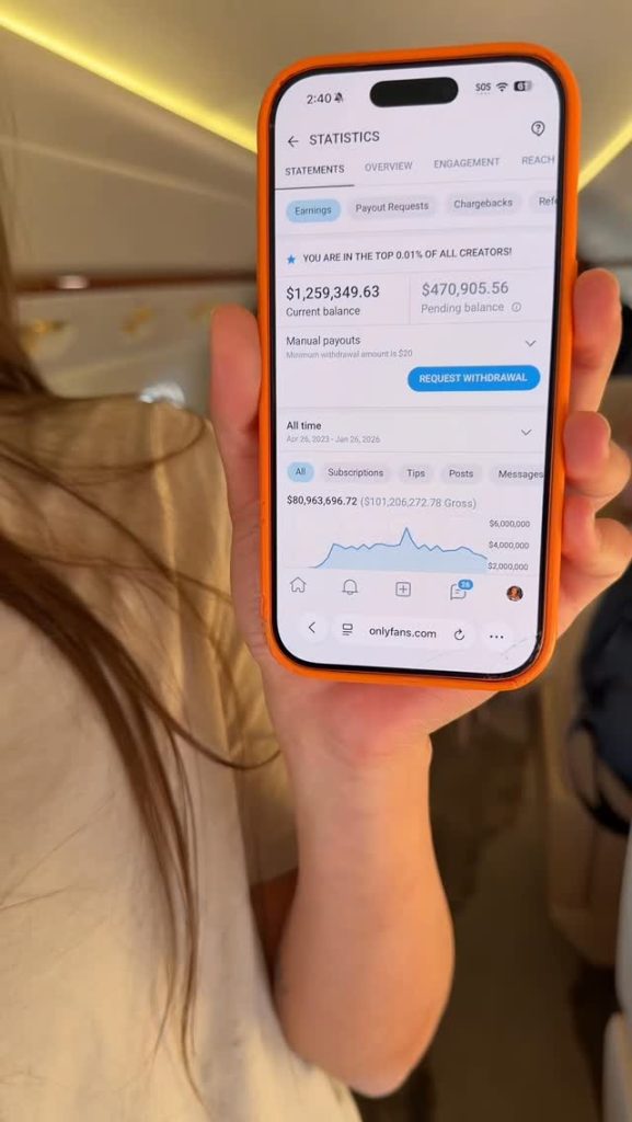 A close-up of a phone screen showing high earnings; a central financial figure in the sophie rain biography.