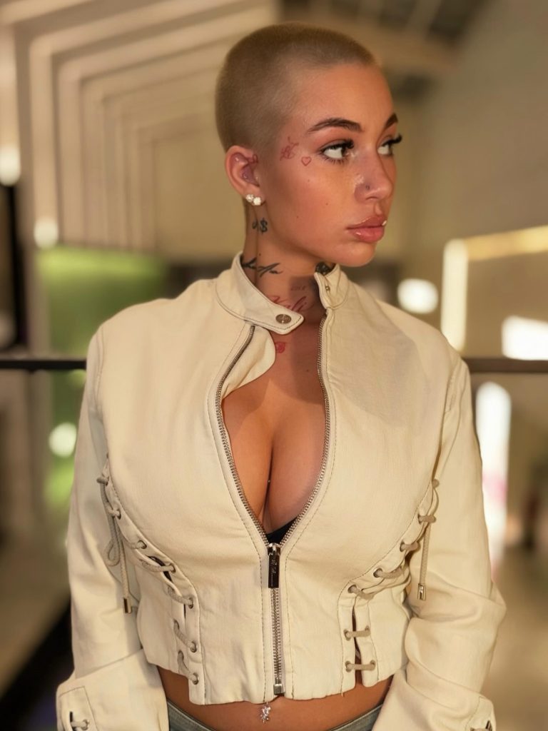 Close-up portrait of Bhad Bhabie wearing a cream jacket, featured as a popular Lightskin OnlyFans creator.