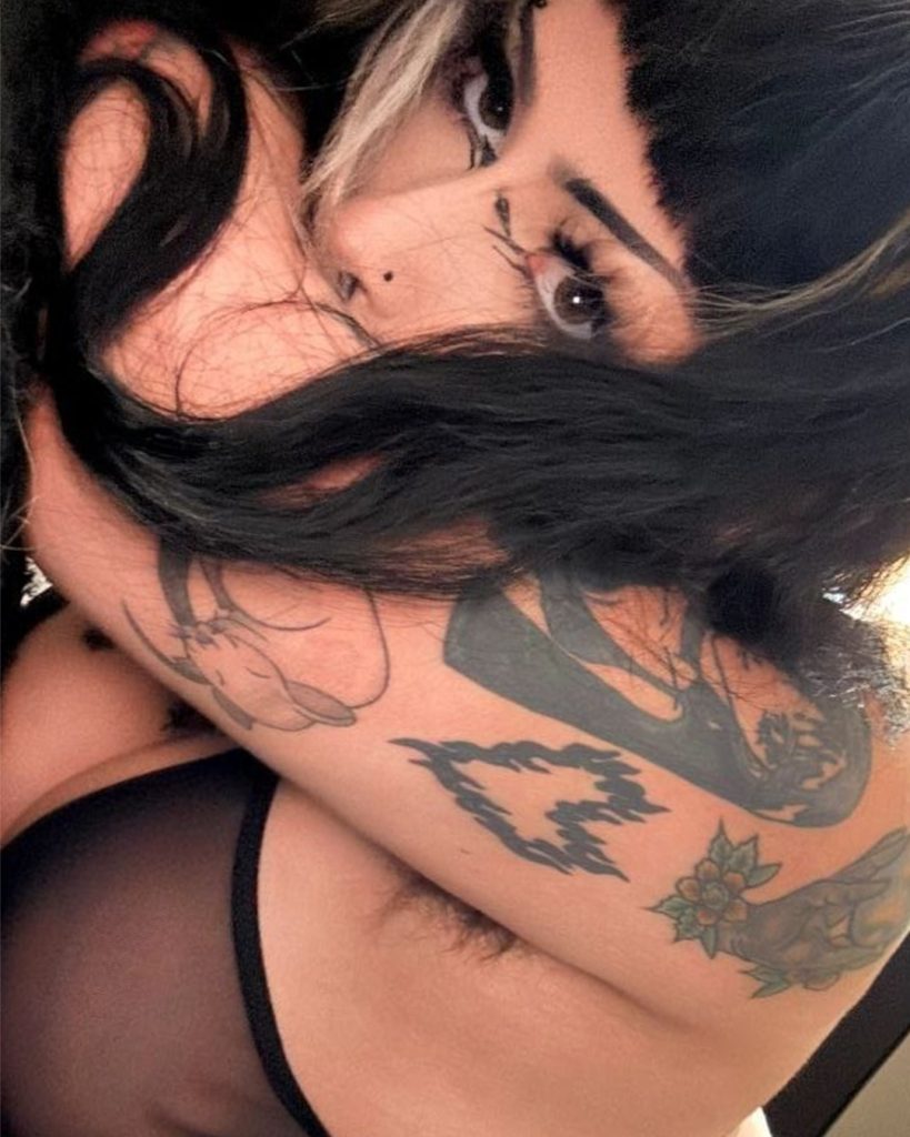 Close-up portrait of tattooed alt creator Bella Luna, featured among the best goth onlyfans profiles.