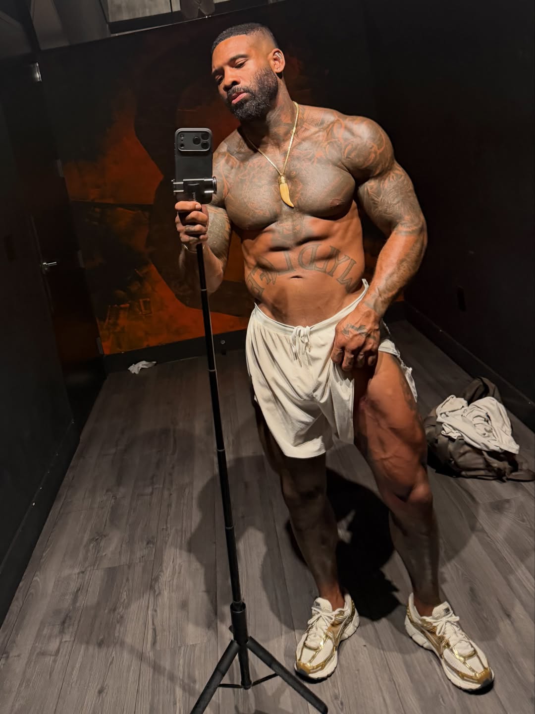 Tattoos and physique showcase selfie by gym creator,