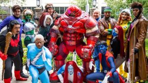 A large group of X-Men cosplayers showcasing dynamic group suits, highlighting top cosplay trends at anime and comic conventions.