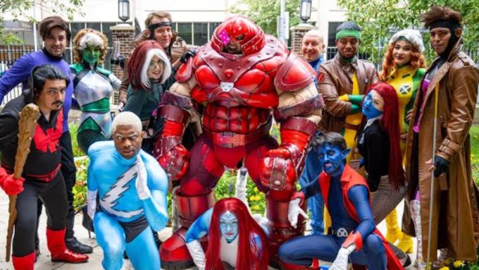A large group of X-Men cosplayers showcasing dynamic group suits, highlighting top cosplay trends at anime and comic conventions.