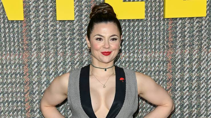 Former Skins actress Megan Prescott smiling on a red carpet event, framed in a commentary piece on Megan Prescott OnlyFans earnings