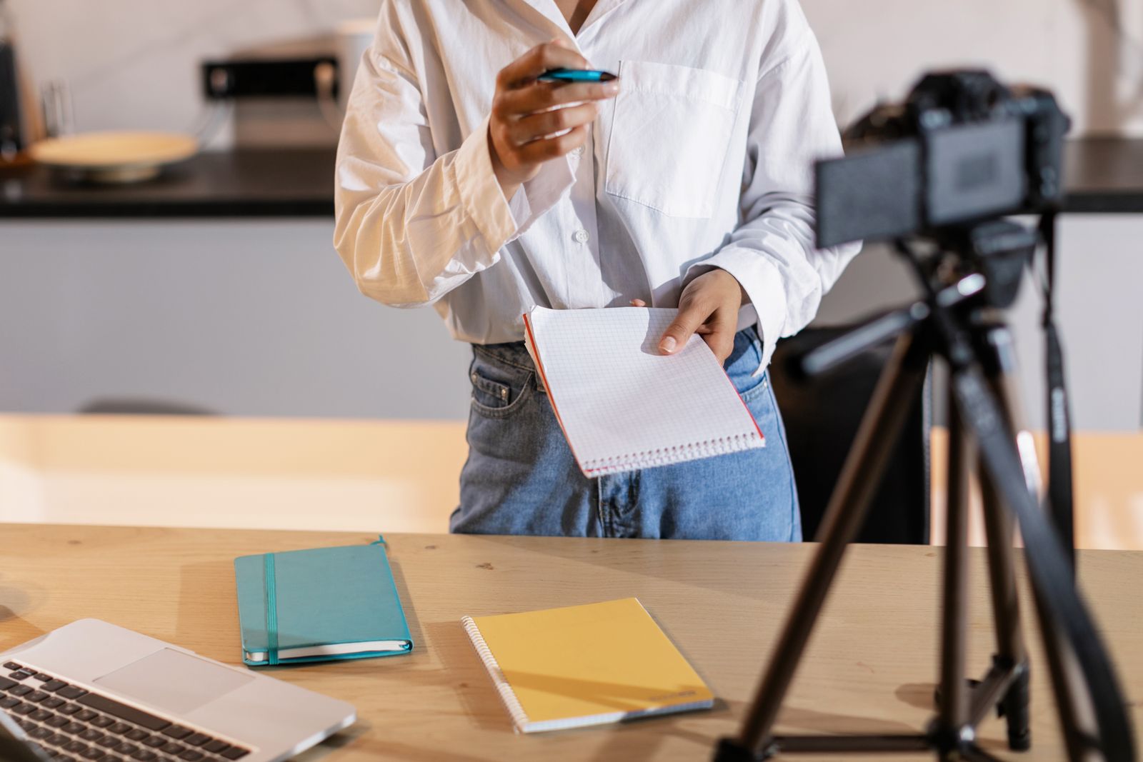 content creator filming a video with camera and tripod setup