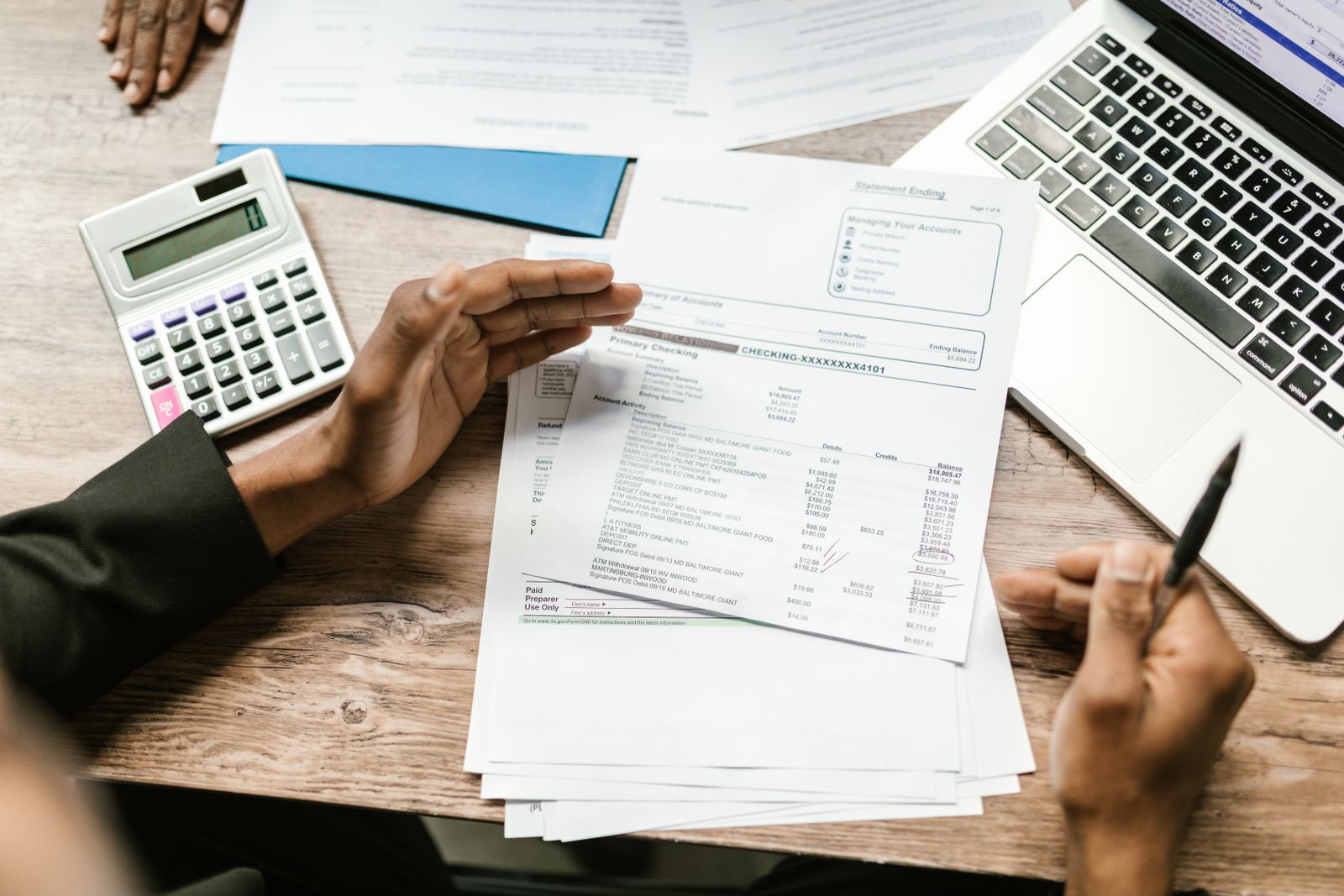 Financial documents and calculator representing creator income tax planning