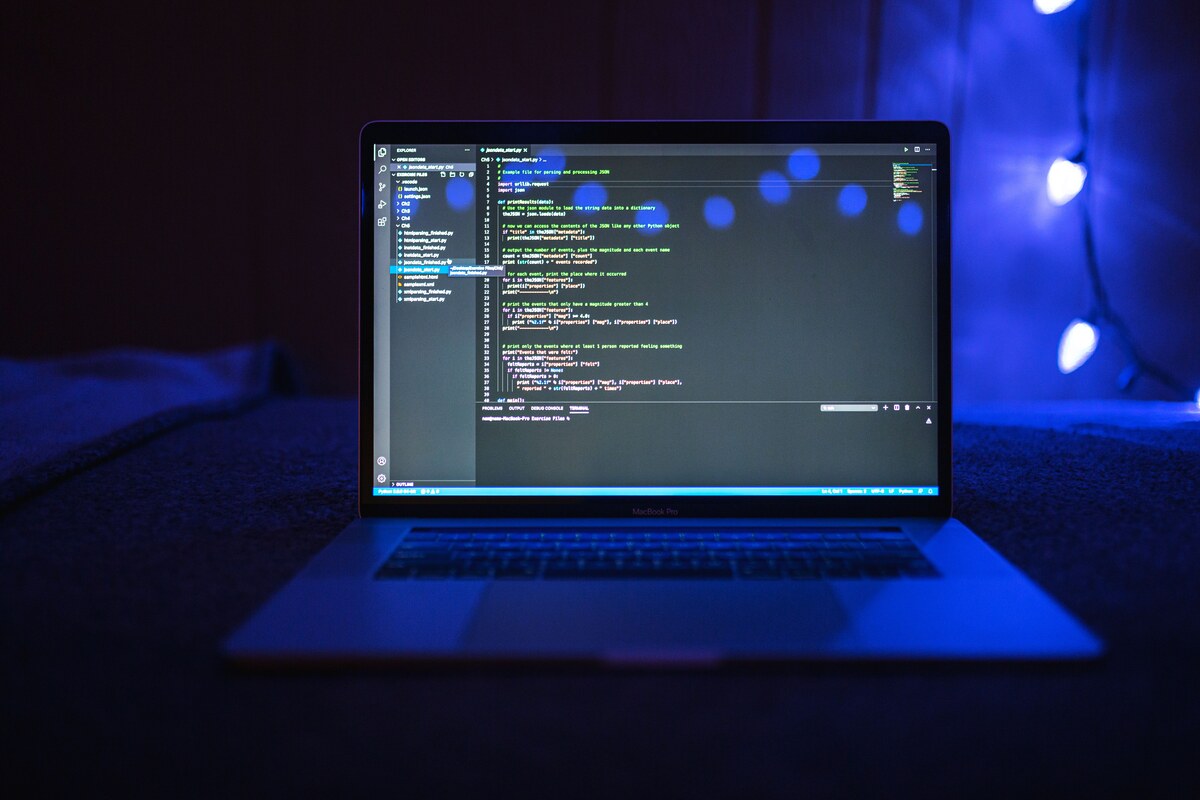 Code on a laptop screen symbolizing platform compliance and AI content moderation policy