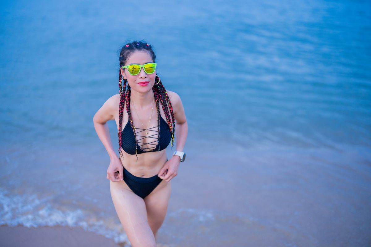 Woman creating beach lifestyle content during summer