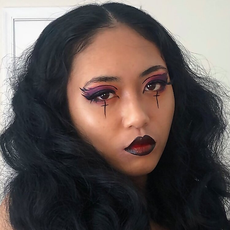 Angeline X showcasing dramatic gothic makeup and dark styling for her Filipina OnlyFans page.