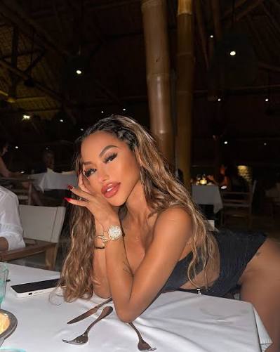 Christianne Ramelb, known as CJ Miles, photographed at a candlelit dinner for a Filipina OnlyFans profile