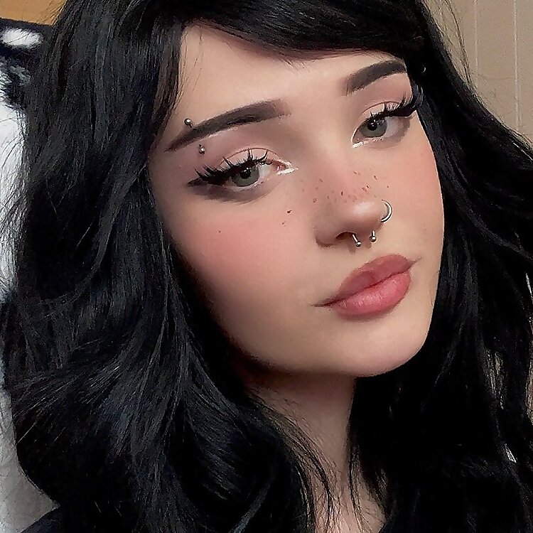 Portrait of a popular e girl onlyfans creator featuring distinctive makeup and piercings