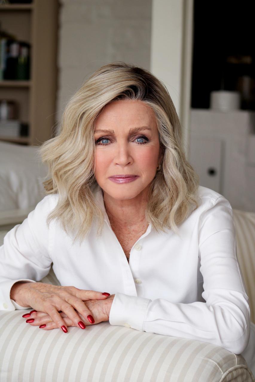 Close-up portrait of actress Donna Mills Knots Landing star wearing a white collared shirt.