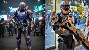 Two cosplayers showcasing detailed futuristic Armor Cosplay with LED accents and large props at a convention.