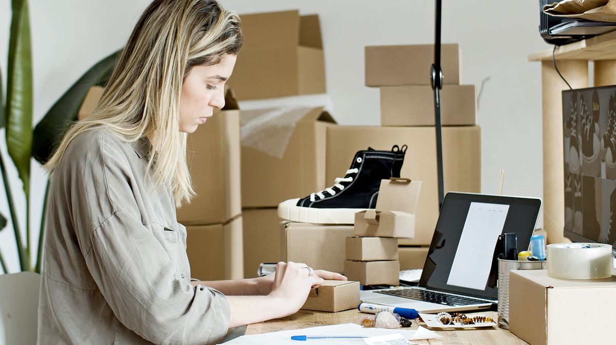 Creator packing orders at home while running a small online business with OnlyFans creator tools
