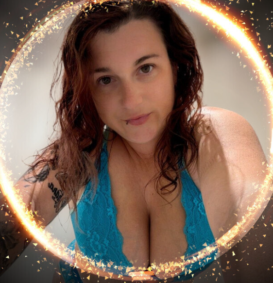 Alice Fury wearing a blue lace top, featured in guides for Yoga OnlyFans creators.