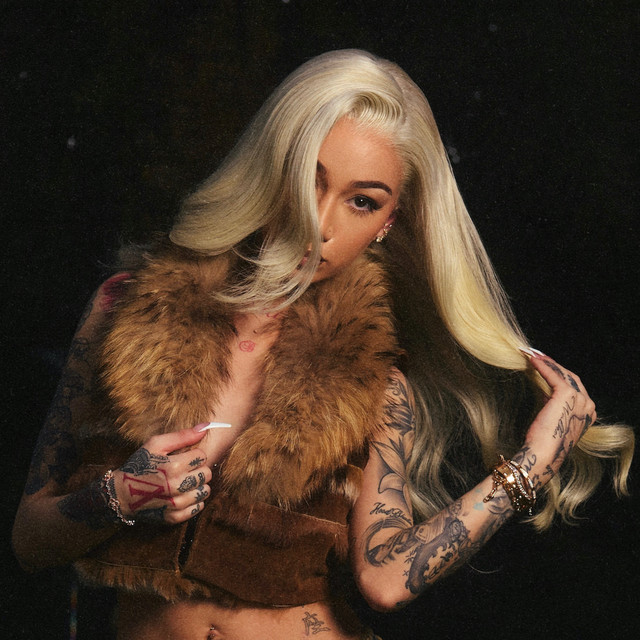 Rapper and internet personality Bhad Bhabie posing with blonde hair and a fur vest, noted as one of the Highest Paid OnlyFans Creators.