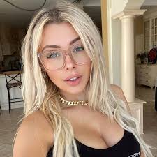 Corinna Kopf wearing glasses, featured in roundups of top YouTubers With OnlyFans.