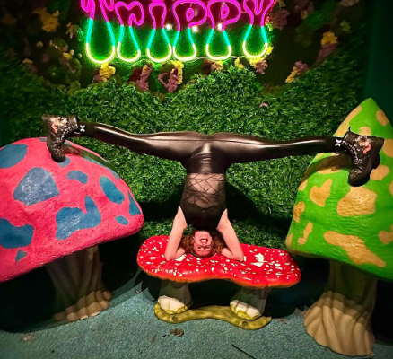 Shy Foxten doing a flexibility pose indoors, highlighting Yoga OnlyFans performances