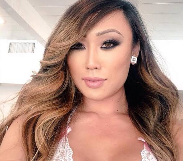 A close-up portrait of adult film star Venus Lux.